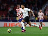Atletico Madrid's Rodrigo de Paul in action with Valencia's Justin Kluivert on March 18, 2023
