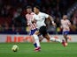 Atletico Madrid's Rodrigo de Paul in action with Valencia's Justin Kluivert on March 18, 2023