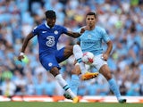 Chelsea's Noni Madueke in action with Manchester City's Rodri on May 21, 2023 