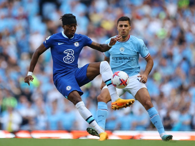 Chelsea's Noni Madueke in action with Manchester City's Rodri on May 21, 2023 