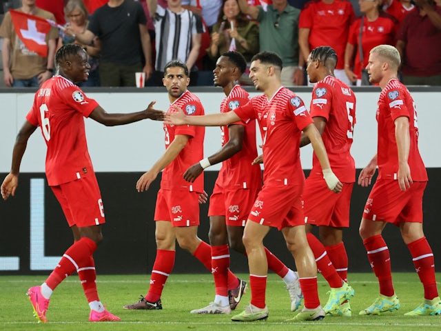 Switzerland's Zeki Amdouni celebrates scoring their first goal with teammates on June 19, 2023