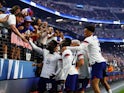 USA celebrates with fans after forward Folarin Balogun (20) scores a goal on June 17, 2023