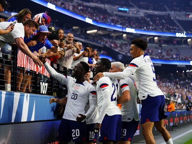 USA celebrates with fans after forward Folarin Balogun (20) scores a goal on June 17, 2023