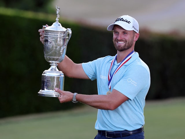 Wyndham Clark celebrates with the championship trophy after winning the US Open golf tournament at Los Angeles Country Club on June 18, 2023
