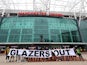 Manchester United fans display a banner in protest against the Glazer family's ownership of the club on June 27, 2023