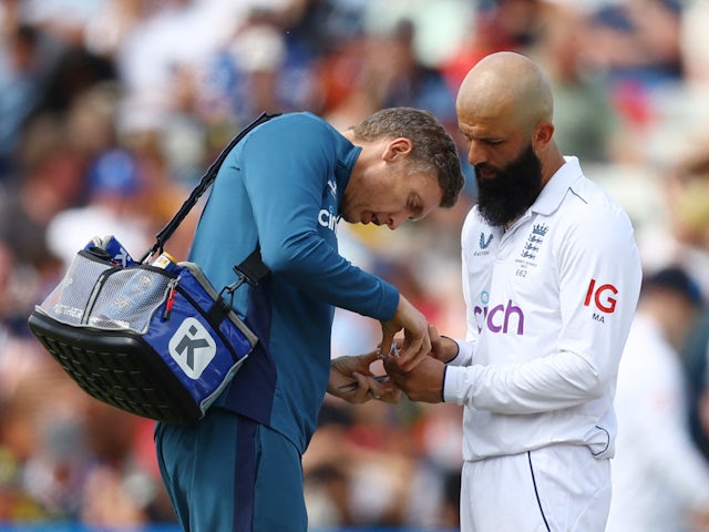 England's Moeen Ali receives medical attention on June 20, 2023