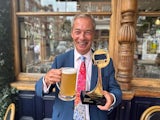 Nigel Farage celebrates his TRIC Awards win