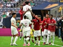Qatar forward Yusuf Abdurisag (11) celebrates his goal with teammates on June 25, 2023