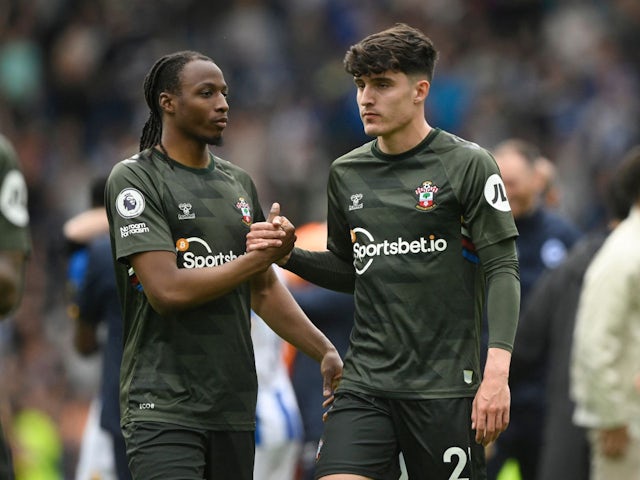 Southampton's Joe Aribo and Tino Livramento look dejected after the match on May 21, 2023