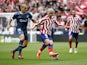 Atletico Madrid's Antoine Griezmann in action with Girona's Oriol Romeu on October 8, 2022
