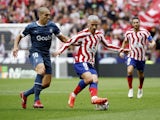Atletico Madrid's Antoine Griezmann in action with Girona's Oriol Romeu on October 8, 2022