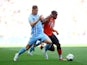 Coventry City's Callum Doyle in action with Luton Town's Pelly-Ruddock Mpanzu on May 27, 2023