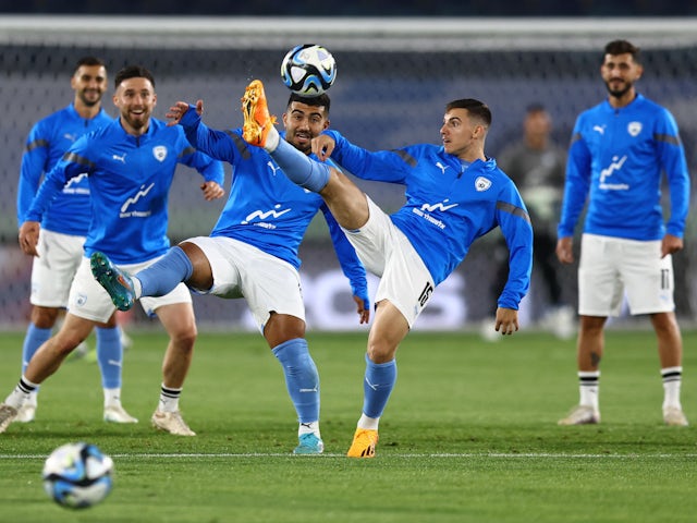 Israel's Oscar Gloukh with teammates during the warm up before the match on June 19, 2023