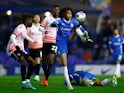Birmingham City's Tahith Chong in action with Reading's Amadou Salif Mbengue on December 16, 2022