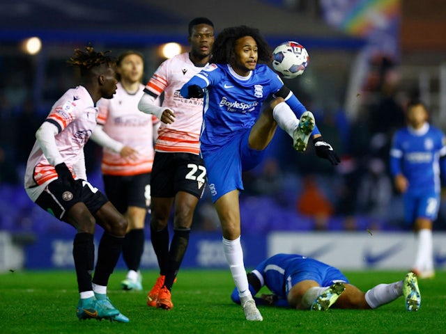 Birmingham City's Tahith Chong in action with Reading's Amadou Salif Mbengue on December 16, 2022