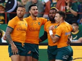 Australia's Marika Koroibete celebrates with teammates after scoring their first try on July 8, 2023