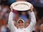 Marketa Vondrousova lifts the Venus Rosewater Dish after beating Ons Jabeur in the Wimbledon final on July 15, 2023