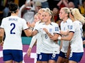 England's Georgia Stanway celebrates scoring their first goal with teammates on July 22, 2023