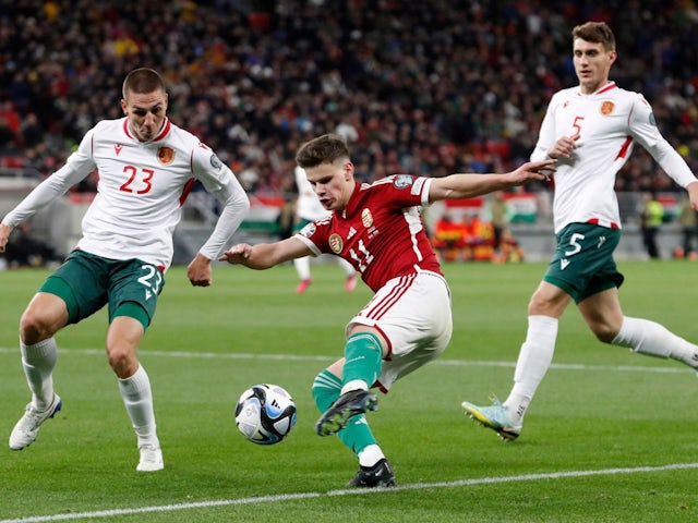 Hungary's Milos Kerkez in action with Bulgaria's Valentin Antov and Plamen Galabo on March 27, 2023