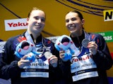 Britain's Scarlett Mew Jensen and Yasmin Harper celebrate on the podium on July 17, 2023