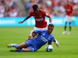 Lyon's Corentin Tolisso in action with Manchester United's Amad Diallo on July 24, 2023