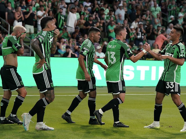 Austin FC midfielder Ethan Finlay (13) celebrates with teammates after scoring a goal on July 30, 2023