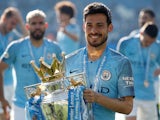 Manchester City's David Silva poses with the Premier League trophy on May 12, 2019 
