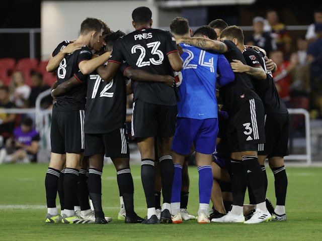 DC United players huddle prior to their match on July 30, 2023