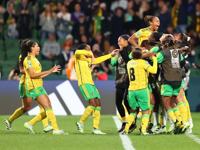 Jamaica Women's Allyson Swaby celebrates scoring their first goal with teammates on July 29, 2023
