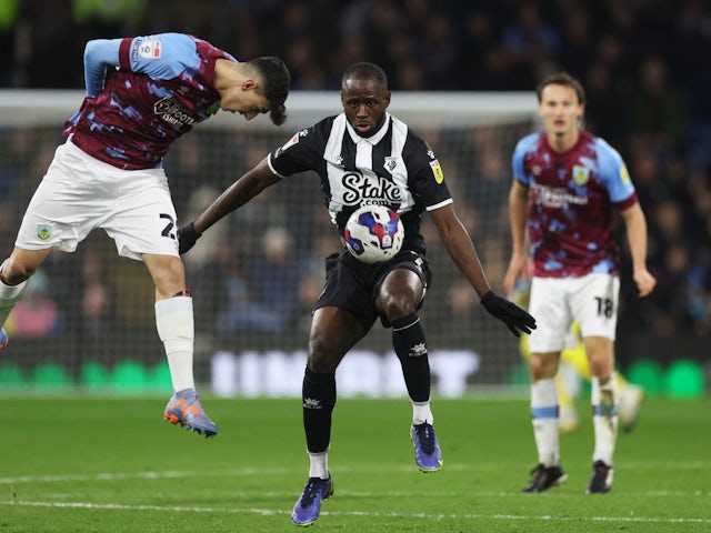 Watford's Keinan Davis in action with Burnley's Ameen Al-Dakhil on February 14, 2023
