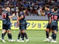 Manchester City's James McAtee celebrates scoring their first goal with teammates on July 26, 2023