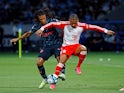 Manchester City's Nathan Ake in action with Bayern Munich's Leroy Sane on July 26, 2023