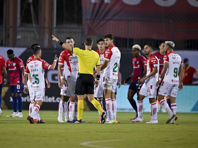 Necaxa midfielder Alan Montes (23) receives a red card on July 26, 2023