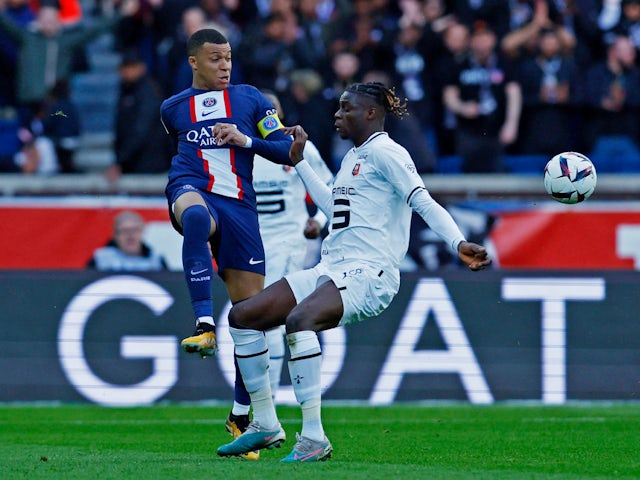 Rennes' Lesley Ugochukwu in action with Paris Saint-Germain's Kylian Mbappe in March 2023