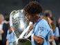 Manchester City's Rico Lewis kisses the trophy as he celebrates winning the Champions League on June 11, 2023