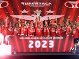 Benfica's Nicolas Otamendi celebrates with the trophy and teammates after winning the Supertaca on August 9, 2023