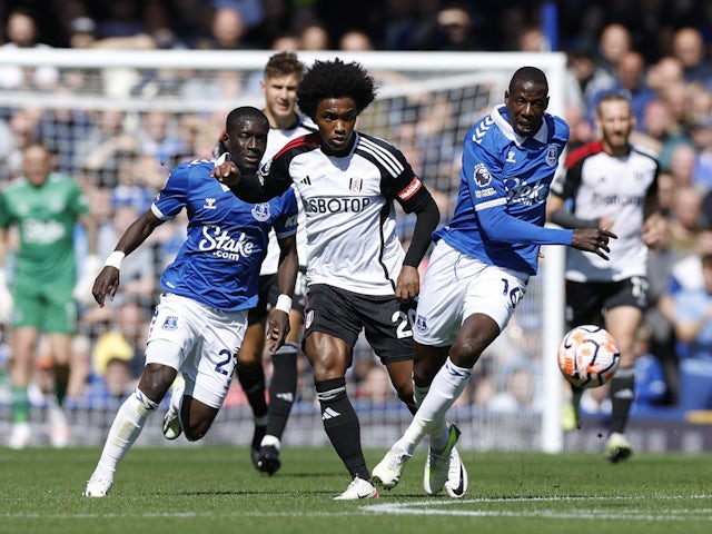 Everton's Idrissa Gueye and Abdoulaye Doucoure in action with Fulham's Willian on August 12, 2023