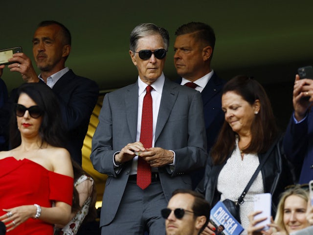 Liverpool owner John W Henry with his wife Linda Pizzuti in the stands before the match on August 13, 2023
