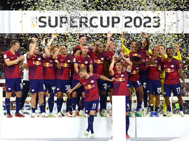 RB Leipzig's Willi Orban lifts the trophy with teammates after winning the DFL Super Cup on August 12, 2023