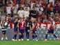 RB Leipzig's Dani Olmo celebrates scoring their third goal with teammates and completes his hat-trick on August 12, 2023
