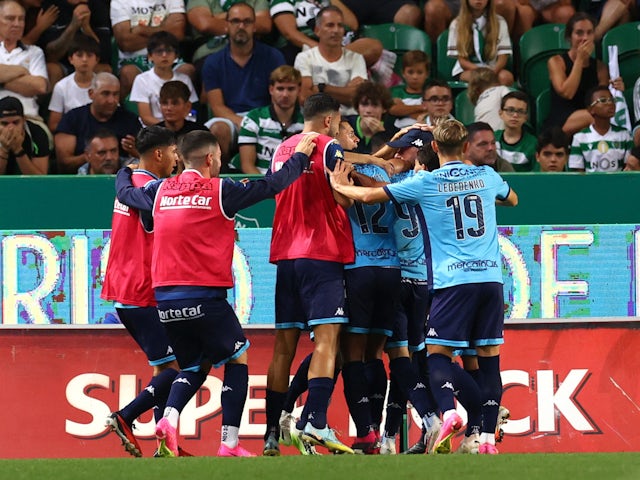 Vizela's Nuno Moreira celebrates scoring their second goal with teammates on August 12, 2023