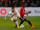 Lille's Carlos Baleba in action with Lens' Alexis Claude Maurice on October 9, 2022
