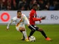 Lille's Carlos Baleba in action with Lens' Alexis Claude Maurice on October 9, 2022