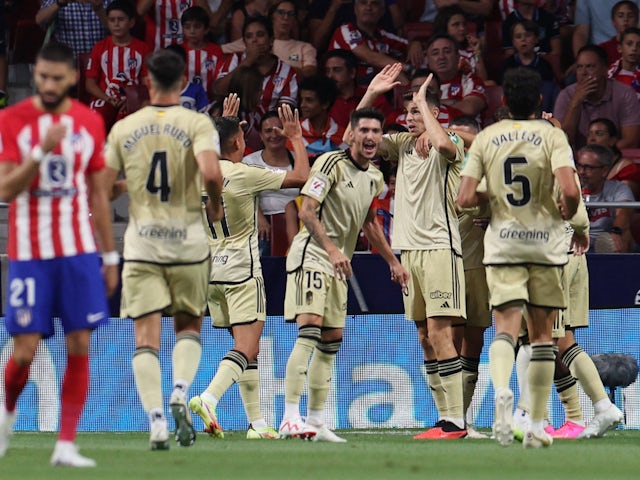 Granada players celebrate after Samu scores their first goal on August 14, 2023