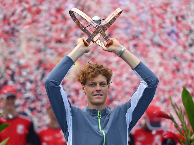 Jannik Sinner poses with the trophy after winning the Canadian Open on August 13, 2023