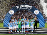 Manchester City's Kyle Walker celebrates with the trophy after winning the UEFA Super Cup on August 16, 2023