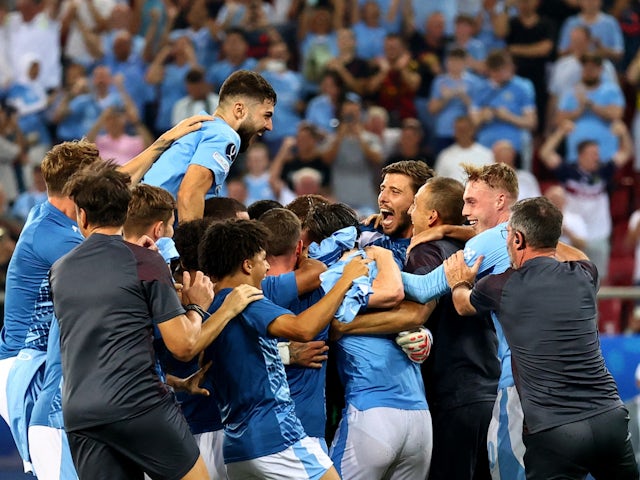 Manchester City players celebrate after winning the UEFA Super Cup on August 16, 2023