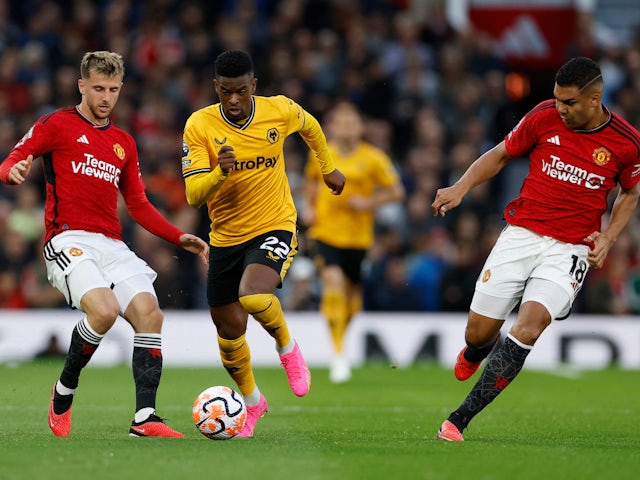 Manchester United's Mason Mount and Casemiro in action with Wolverhampton Wanderers' Nelson Semedo on August 14, 2023