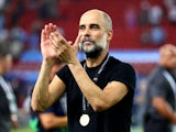 Manchester City manager Pep Guardiola celebrates after winning the UEFA Super Cup on August 16, 2023