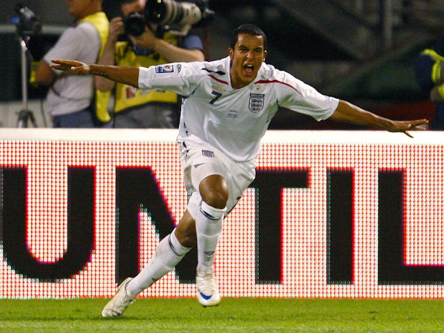 Theo Walcott celebrates scoring for England in August 2008